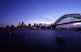 the sydney skyline and bridge after sunset, long exposure (blurred boats)